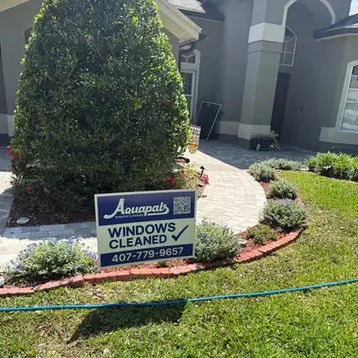 Aquapals Windows Cleaned yard sign at a Central Florida home