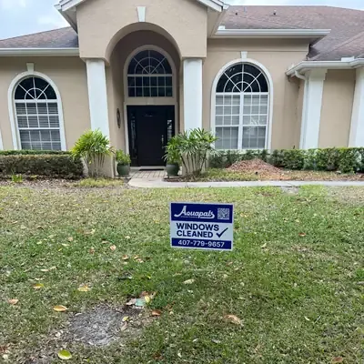 Aquapals Windows Cleaned yard sign at a Central Florida home