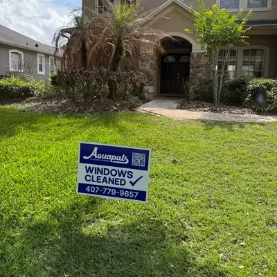 Aquapals Windows Cleaned yard sign at a Central Florida home