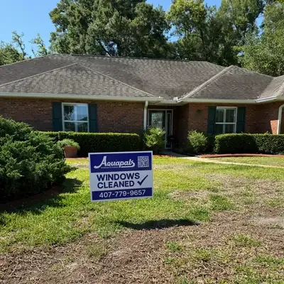 Aquapals Windows Cleaned yard sign at a Central Florida home