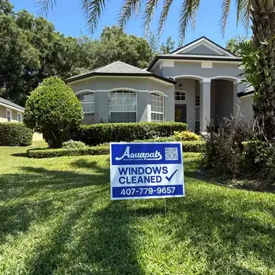 Aquapals Windows Cleaned yard sign at a Central Florida home