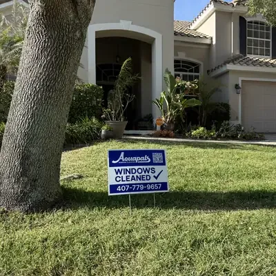 Aquapals Windows Cleaned yard sign at a Central Florida home