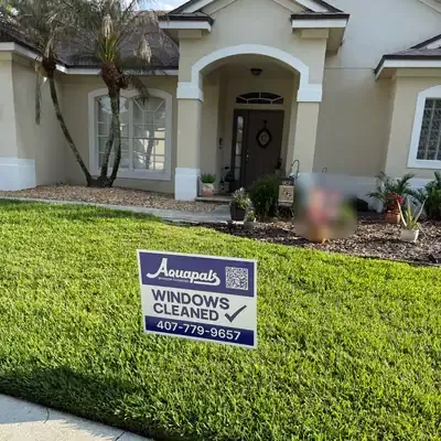 Aquapals Windows Cleaned yard sign at a Central Florida home