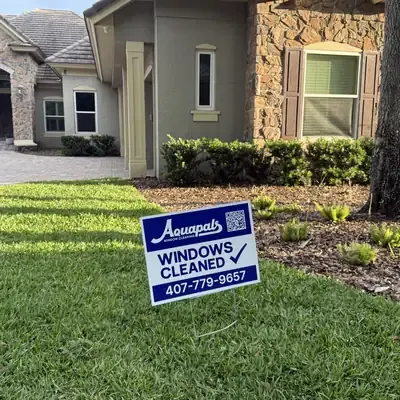 Aquapals Windows Cleaned yard sign at a Central Florida home