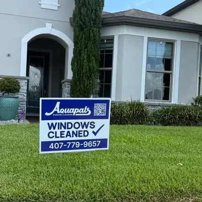 Aquapals Windows Cleaned yard sign at a Central Florida home