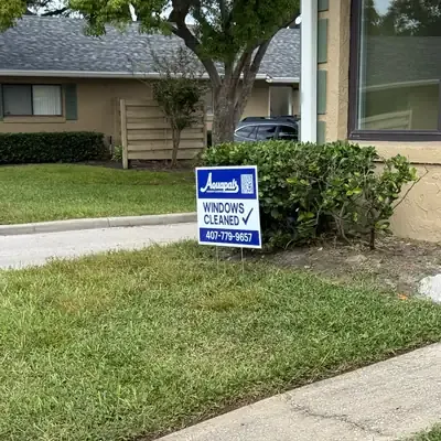 Aquapals Windows Cleaned yard sign at a Central Florida home